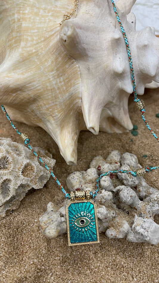 collana in cordoncino con amuleto occhio portafortuna in metallo placcato oro